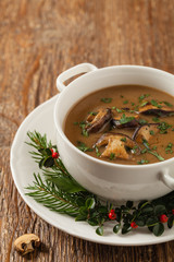 Traditional mushroom soup, made from porcini mushrooms. Christmas decoration.