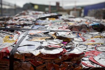 Flattened cans in a recycling centre in the UK