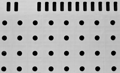 round windows of a large cruise ship in black and white. the decks of a huge ship in an abstract form.