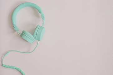 vintage mint headphones on a pink background
