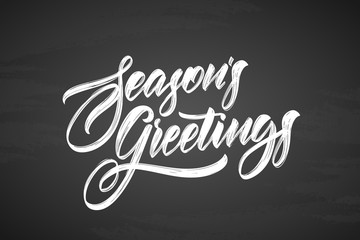 Vector illustration. Handwritten calligraphic brush txtured lettering of Seasons Greetings on chalkboard background
