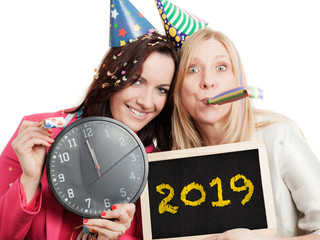 Two women hold chalkboard for the new year 2019 - isolated on white background