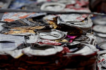 Flattened cans in a recycling centre in the UK