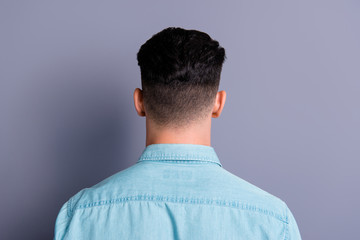 Rear back view of attractive handsome man wearing blue formal sh