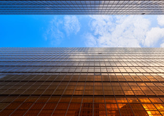 abstract perspective of buildings with golden light and blue sky