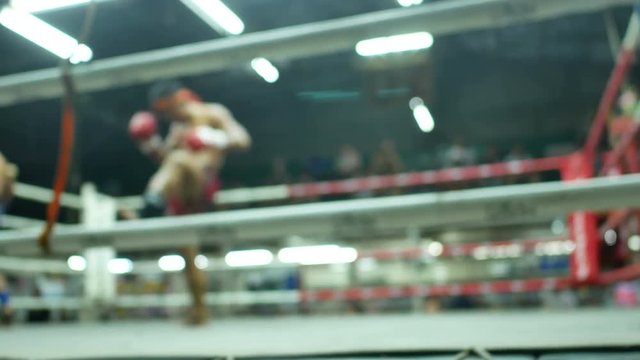 asian boxer slow dance for respect teacher of thai boxing before competition on canvas stadium