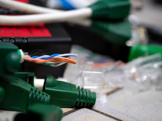 UTP ethernet cables.close up macro shot  with tools and cables background.