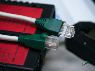 UTP ethernet cables.close up macro shot  with tools and cables background.