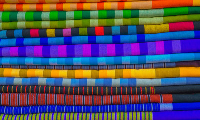 Asian Fabric Pattern in Shop Available at Fabric Market in Thailand, Beautiful Household handicrafts of Thai silk, Mix the colors of the beautiful crafts hanging, Design for the background 