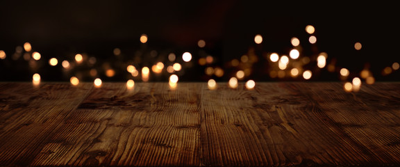 Gold and silver lights on dark wood