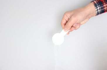 detergent powder pour on a light background