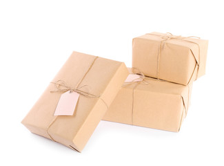 Parcels wrapped in kraft paper on white background