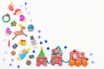 Naklejka premium Merry Christmas greeting card with decorations. Santa, Christmas train with tree and sweets, snowman, reindeer and gifts