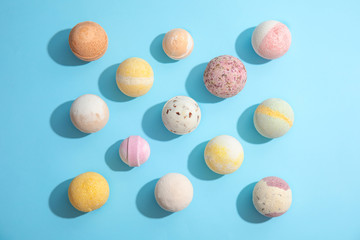 Flat lay composition with bath bombs on color background