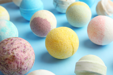 Many different bath bombs on color background