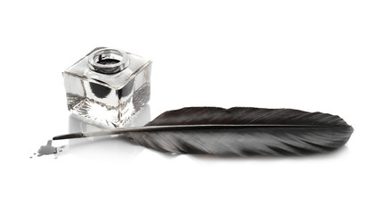 Feather pen and inkwell on white background