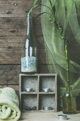 natural spa and wellness background, raw wood, candles, blue and green colors