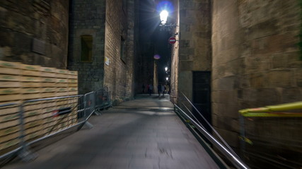 Fast walk through narrow street in the Old Town timelapse hyperlapse, Barcelona. Gothic district illuminated at night
