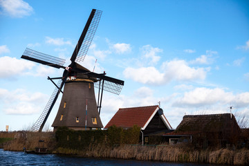 Fototapeta na wymiar Dutch windmills, Holland, rural expanses . Windmills, the symbol of Holland.