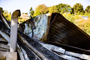 Burned damaged ruins of destroyed boiler room in supermarket. Arson investigation insurance
