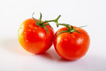 Fresh tomatoes isolated on white background.