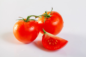 Fresh tomatoes isolated on white background.