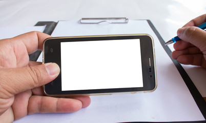 Asian man holding his blank smartphone during work in office