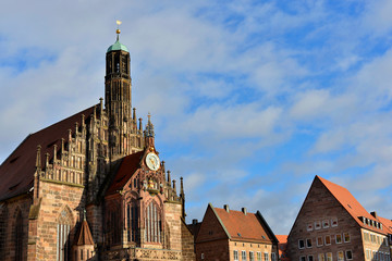 Fototapeta na wymiar Church of Our Lady (Frauenkirche) and historical buidings in the center of Nuremberg.