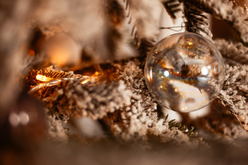 Glass ball on Christmas tree close-up. New Year background