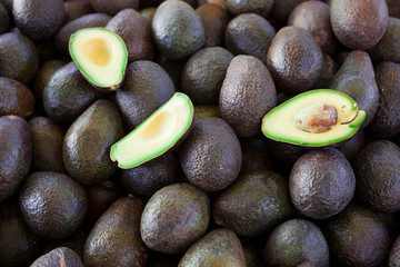 Fresh juicy fruits avocado lying on the counter. Great photo for a fruit-store.