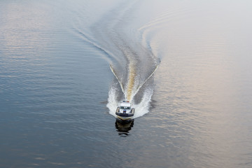 Police boat on the river in the evening