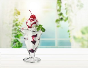 Tasty ,sweet Ice Cream  in cup on background