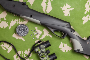hunting kit, air rifle, calimator sight, binoculars, matches,