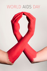 red ribbon and text world aids day