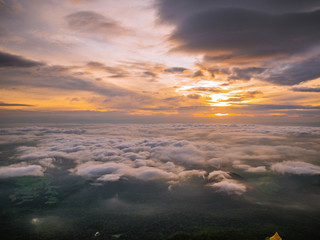 Beautiful Sunrise Sky with Sea of the mist of fog in the morning on Khao Luang mountain in Ramkhamhaeng National Park,Sukhothai province Thailand