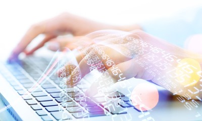 Man's hand typing on keyboard. close up
