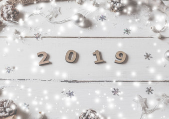 Fototapeta premium Christmas flat lay styled scene - top view frame with christmas decorations on a white background, Idea of merry new year 2019 holiday. Top view