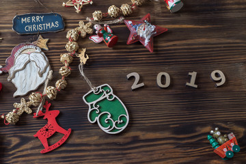 a lot colorful star toys on old wooden texture background. Empty copy space for inscription. Idea of merry new year 2019 holiday. Top view