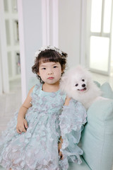 Little pretty Asian girl dressing as princess laughing portrait, healthy and happy lifestyle..