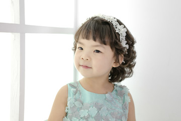 Little pretty Asian girl dressing as princess laughing portrait, healthy and happy lifestyle.
