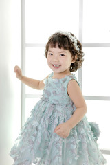 Little pretty Asian girl dressing as princess laughing portrait, healthy and happy lifestyle..
