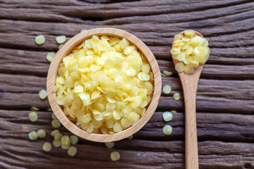 pure organic yellow beeswax pellets for homemade natural  beauty and D.I.Y. project. - obrazy, fototapety, plakaty