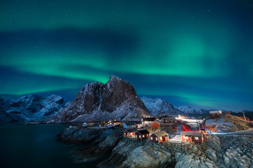 Fisherman village with Aurora in the background travel concept world explore northern light / Lofoten Norway - obrazy, fototapety, plakaty