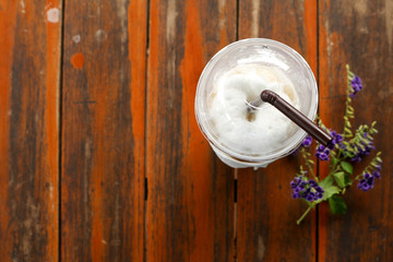 Glass of Cold Iced Coffee put on old table