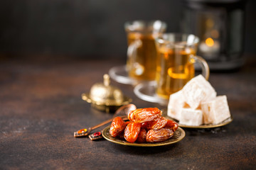 Dried dates and tea in the glasses