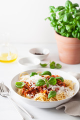 spaghetti bolognese with basil and parmesan, italian pasta