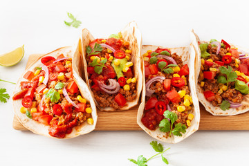 mexican beef and pork tacos with salsa, guacamole and vegetables