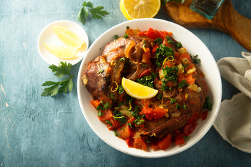 Traditional Italian Ossobuco with lemon and parsley sauce