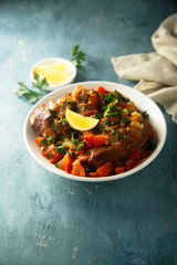 Traditional Italian Ossobuco with lemon and parsley sauce