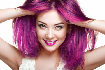 Beauty Fashion Model Girl with Colorful Dyed Hair. Girl with perfect Makeup and Hairstyle. Model with perfect Healthy Dyed Hair. Pink Hair. Woman Smiling